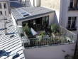 Un ancien atelier transformé en loft avec terrasse sur les toits