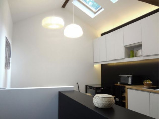 Une ancienne loge de gardien transformée en duplex lumineux